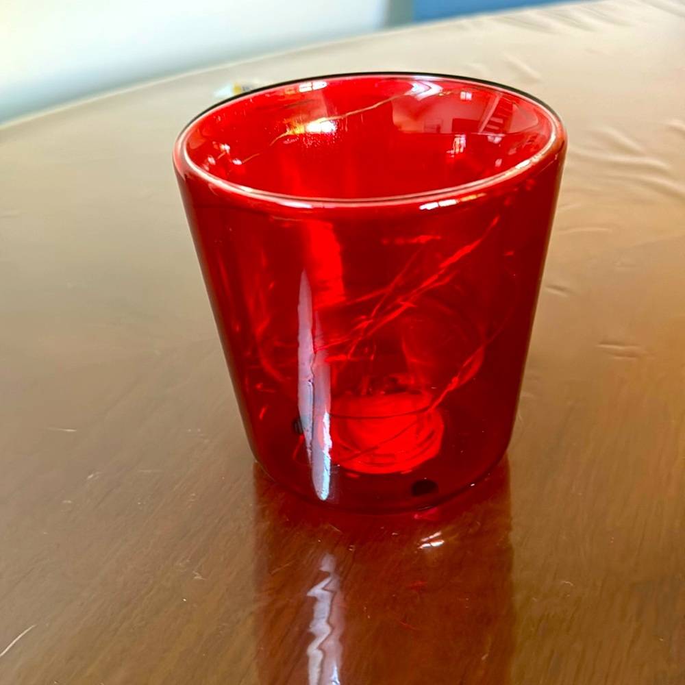 It’s little decorative vase you can decorate with flowers or anything you like.